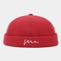 Detail of red canvas docker hat featuring white cursive me embroidery on the cuff - Adjustable / Red