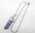 Macro detail of hexagonal sodalite crystal pendulum with silver chain and clasp - Blue Spot Stone