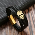 Close-up of black braided leather multi-layer bracelet with golden skull and magnetic clasp - Black + Gold