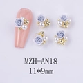 Detailed view of resin blue rose nail charms with faux pearls and gold beads on pink nails - Light Blue Rose Style (AN18)