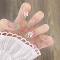 Detail of square pink green gradient press-on nails with 3D butterfly and pearls - Z618 Green Gradient Butterfly / Nail Glue Version
