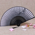 Classic folding fan with black frame, grey silk plum blossom art and silk tassel detail - Ink Plum Blossom