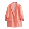 Detail of coral orange blazer showing folded cuffs with gold buttons and flap pockets - S / Coral