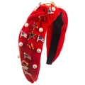 Red knotted headband with American flag charms, pearls, and rhinestones on white background - Red