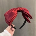 Elegant large red satin bow headband with a high crown design for women's hair styling - Large Bow Headband / Red
