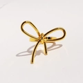 Minimalist golden metal bow ring with sleek polished finish shown on white background - US 7 / Gold