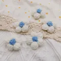 Set of five handmade milk cotton knit flowers in white and blue for DIY hair accessories - White with Blue Center