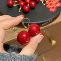 Retro red resin round earrings with golden hooks, 2cm diameter festive jewelry for women - Hoop Buckle Style / Red