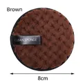 Brown circular facial cleansing sponge with soft plush texture and black handle strap - 8cm / Brown