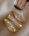 Three-piece gold adjustable ring set featuring pearls, rhinestones, and cross charm - Pearl Cross Gold Stackable Ring Set