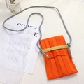 Detail view of the orange knitted pleated phone bag with gray knotted shoulder strap - One Size / Fruit Orange Bag + Grey Rope