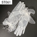Detail of white bridal mesh glove with elegant 3D bow, pearls and delicate beaded tassels - White Mesh 3D Bowknot Pearl Tassel (ST061)