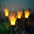 Solar powered Halloween skeleton hand garden stakes with warm LED light for outdoor decor - Ghost Hand Stake Set of 4 (Flame)