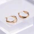 Minimalist gold plated double hoop cross earrings on transparent display stand - Gold