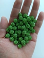 Close-up of 10mm sparkling green rhinestone clay disco beads held in hand for scale - 10mm / Bright Green (18)