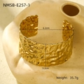 Macro shot of gold wide open bangle with hammered texture and 3.2cm width detail - Hammered Pattern (NMSB-E257-1)