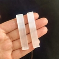 Natural white selenite sticks with silk fiber texture held in hand for healing - White Selenite Stick