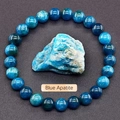 Detail of natural blue apatite beaded bracelet with rough crystal stone on textured background - Apatite