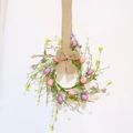 Handcrafted Easter egg wreath with flowers and burlap bow for spring door decoration - 10 Eggs With Linen Bow Hanging Loop