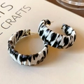 Detailed view of zebra print hoop earrings with gold posts on a light book background - 28# Silver Earring Post - Gold - Black - White - C Shape