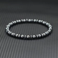 6mm magnetic hematite beaded bracelet with polished dark grey metallic finish - Hematite