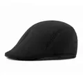 Classic black wool newsboy cap featuring a minimalist vintage flat peak design - M (56-58cm) / Black