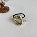 Elastico per capelli nero minimalista con accessorio nodo in metallo dorato lucido - Design a Nodo / Oro