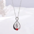 Silver infinity wing necklace featuring a vibrant red heart-shaped gemstone pendant - Silver Infinity Wing Red Heart (A-998)