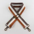 Macro shot of adjustable 5cm wide striped bag strap with vintage bronze metal hooks - Brown White Grey Stripe