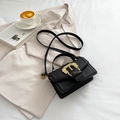 Minimalist black crossbody bag with vintage golden baroque buckle and adjustable strap - Black