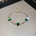 Detailed shot of emerald cut crystals on a gold adjustable bracelet with lobster clasp - No.47 Emerald Green Square Zircon Bracelet-Gold-Green