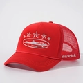 Red embroidered star trucker hat with breathable mesh and adjustable strap back - Red