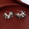 Detail of silver beaded tassel earrings with amber texture beads on red velvet fabric - Silver (Silver Pin)