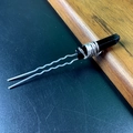 Close-up of U-shaped silver hair pin with elegant black crystal stone and wire detail - Black