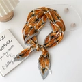 Pleated square scarf featuring orange and gray fan pattern in a tied style display - Grey Border Yellow Fan Pattern