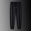 Pantalón jogger negro para hombre con cordón, bolsillo con cremallera y puños elásticos - L / Negro Joggers