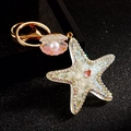 Starfish and seashell pearl keychain with sparkling rhinestones in gold finish - Single OPP Bag Packaging / White Jelly Small Starfish