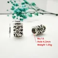Macro view of retro silver carved tube beads with 4.2mm large hole for DIY jewelry - Style 13 (Sunflower Pattern)