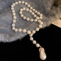 Detailed view of a Y-shaped necklace with round imitation pearls and a teardrop pendant - Y-shaped Water Drop Pearl Pendant Necklace