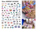 Detail of blue evil eye nail art stickers showing various eye patterns and application on nails - WG886