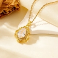 Golden water drop pendant necklace with clear crystal on white stone and silk background - Gold Water Drop White Zirconia (T008)