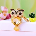 Golden owl keychain with sparkling diamonds and a yellow heart-shaped gemstone - A430 Owl G Champagne
