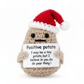 Handmade crochet positive potato wearing a red Christmas hat with an encouraging message - Red Hat Potato