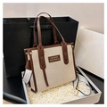 Detail of canvas tote bag with brown leather trim in white gift box with strap - Coffee Small