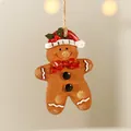 Gingerbread man resin Christmas ornament with red hat and bow on a rustic twine string - Red Berry Gingerbread Man