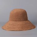 Macro detail of high-quality handmade woven raffia straw sun hat in earth brown - M(56-58cm) / Brown