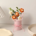 Handmade knitted yarn flower bouquet in pink puff hug bucket with orange and white blossoms - With Light + Bag / White + Orange
