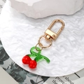 Creative red cherry glass pendant keychain with golden clasp and green leaves - Cherry
