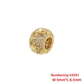 Macro detail of gold plated hollow flower charm bead with pink and clear cubic zirconia - Hollow Flower Style (VZ381) / 5x8.5mm / Gold