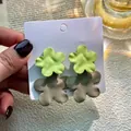 Matte flower stud earrings in olive green and taupe gray on white display card - Green Gray Matte Double Layer Flower Studs